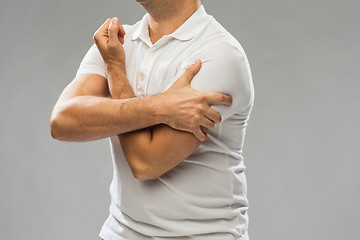 Image showing close up of man suffering from pain in hand