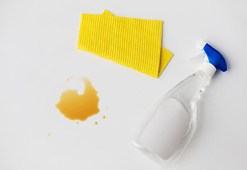 Image showing cleaning rag, detergent spray and spilled stain