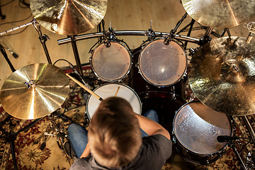 Image showing male musician playing drums and cymbals at concert