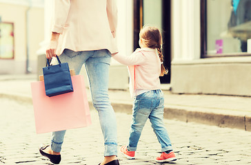 Image showing close up of mother and child shopping in city