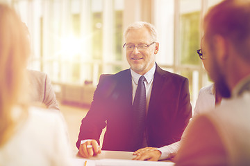 Image showing smiling business people meeting in office