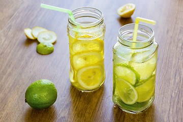 Image showing A couple of cool cocktails of fresh fruit in jars