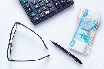 Image showing Business concept: glasses, pen, calculator and money