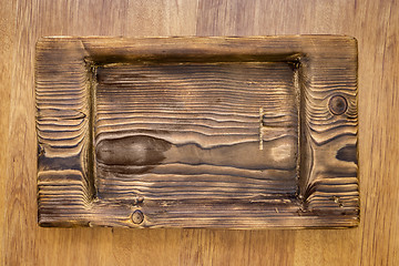 Image showing Coarse rustic wooden plate