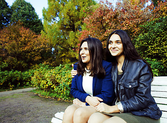 Image showing mature real mother with daughter outside in park, recreation concept, lifestyle people 