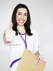 Image showing young pretty woman doctor with stethoscope emotional posing, pointing in camers, lifestyle people concept 