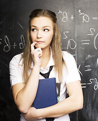 Image showing portrait of happy cute student with book in classroom