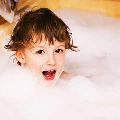 Image showing little cute boy in bathroom with bubbles close up, lifestyle real people concept