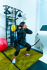 Image showing The female athlete doing they exercise in a ems fitness studio