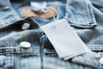 Image showing close up of denim jacket with white price tag