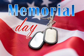 Image showing memorial day words over american flag and dog tags