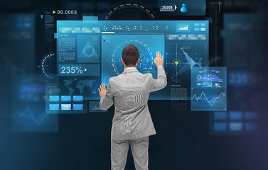 Image showing businessman working with virtual screens