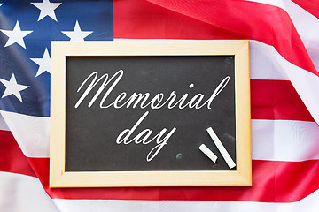 Image showing memorial day words on chalkboard and american flag