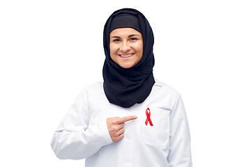 Image showing muslim doctor in hijab with red awareness ribbon