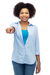 Image showing happy african woman pointing finger to you