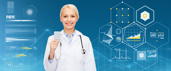 Image showing smiling female doctor with pills