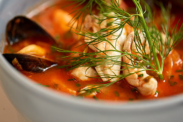 Image showing close up of seafood soup with fish and mussels