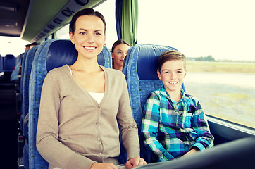 Image showing happy family riding in travel bus