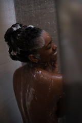 Image showing African American woman in the shower