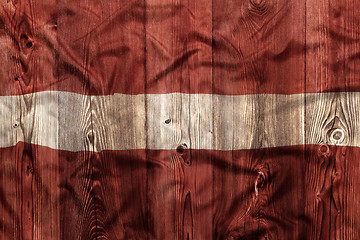 Image showing National flag of Latvia, wooden background