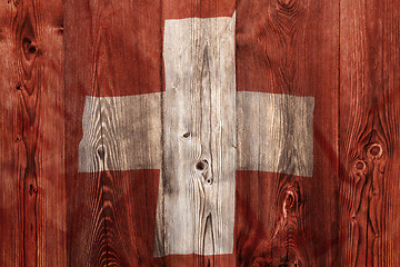 Image showing National flag of Switzerland, wooden background