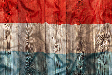 Image showing National flag of Luxembourg, wooden background