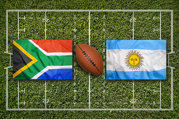 Image showing South Africa vs. Argentina flags on rugby field