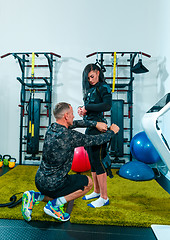 Image showing The female athlete doing they exercise in a ems fitness studio