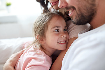 Image showing close up of happy family in bed at home