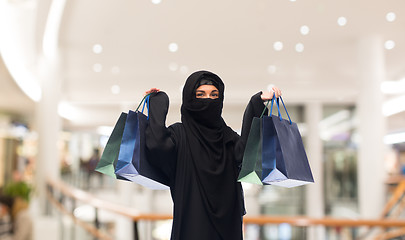 Image showing muslim woman in hijab with shopping bags