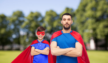 Image showing man and boy wearing mask and red superhero cape