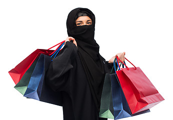 Image showing muslim woman in hijab with shopping bags