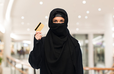 Image showing muslim woman in hijab with credit card over white