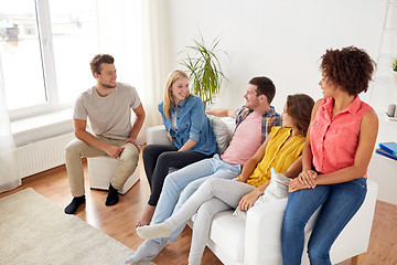 Image showing group of happy friends talking at home