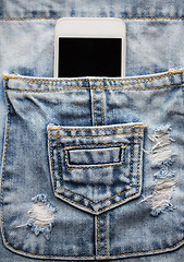 Image showing smartphone in pocket of denim overalls