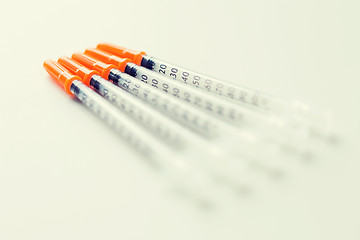 Image showing close up of insulin syringes on table