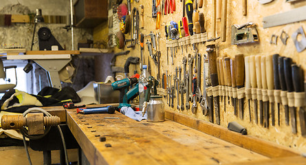 Image showing work tools and workbench at workshop