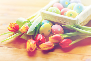 Image showing close up of colored easter eggs and flowers