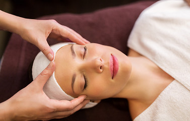 Image showing woman having face and head massage at spa