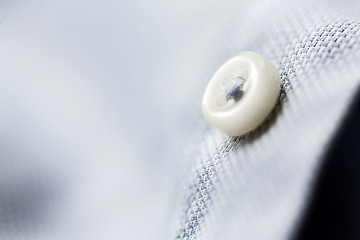 Image showing close up of blue shirt button