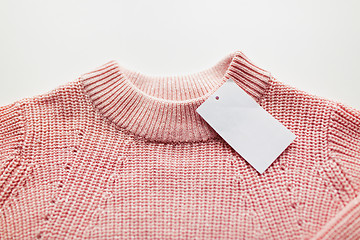 Image showing close up of sweater or pullover with price tag