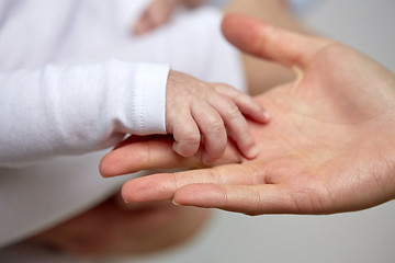 Image showing close up of mother and newborn baby hands