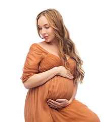 Image showing happy pregnant woman touching her big belly