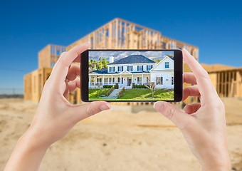 Image showing Female Hands Holding Smart Phone Displaying Photo of House with 