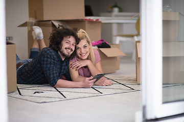 Image showing Young couple moving in a new flat