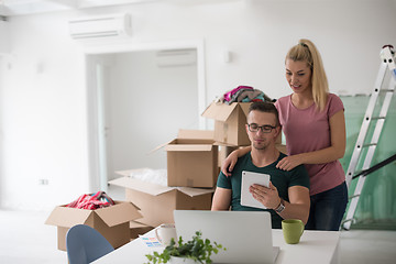 Image showing Young couple moving in a new home