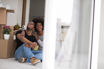 Image showing African American couple relaxing in new house