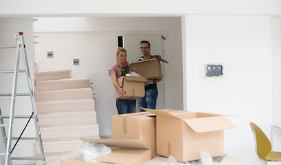 Image showing young couple moving into a new home