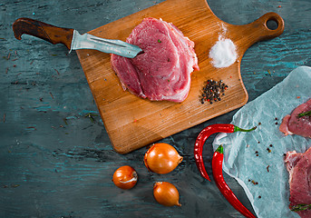 Image showing Pieces of raw pork steak with spices and herbs rosemary