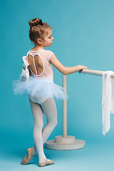 Image showing The little balerina dancer on blue background